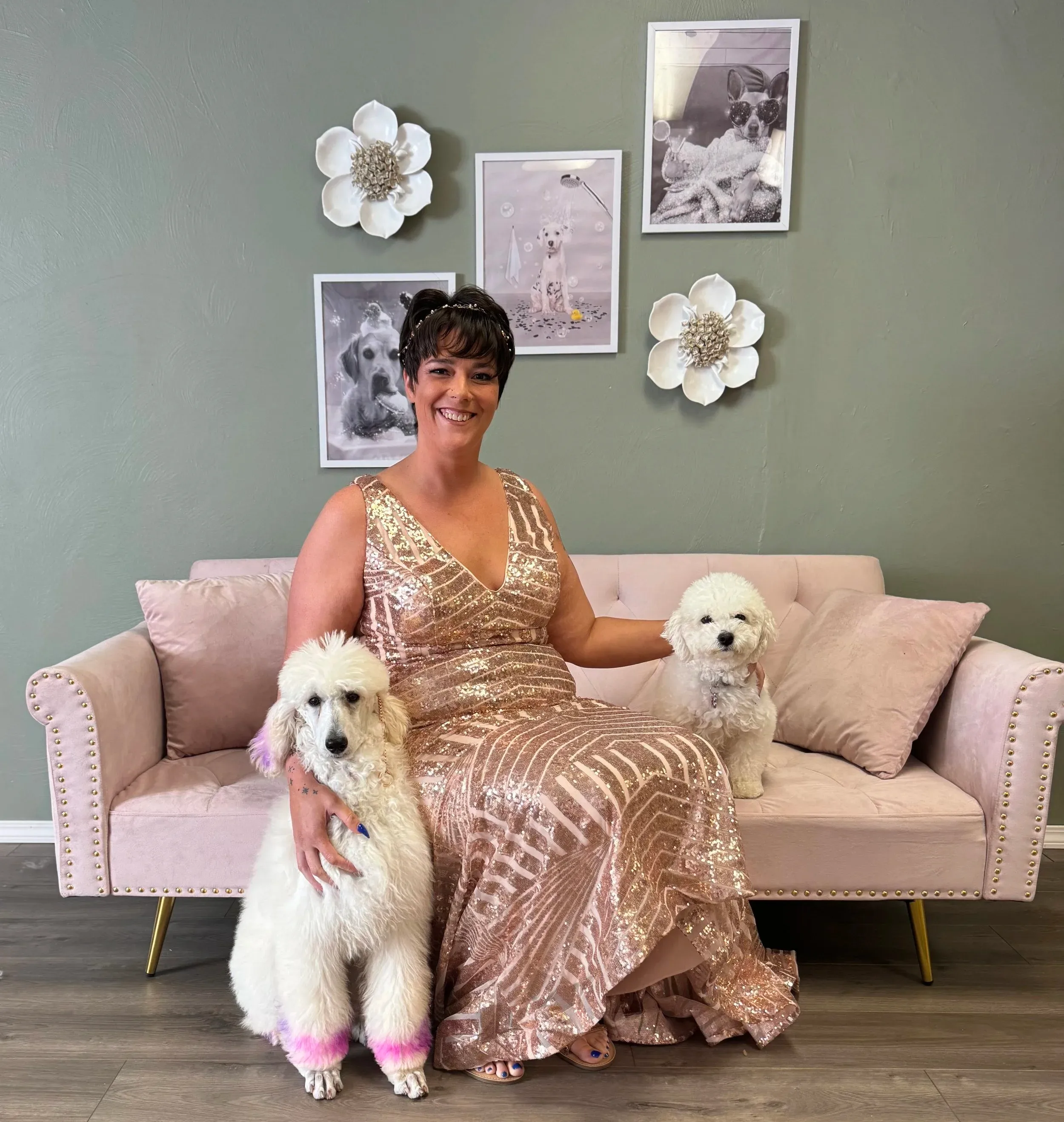 Vanessa Masiye, founder of Nova & Co. Pet Spa, with two of her client poodles in the salon